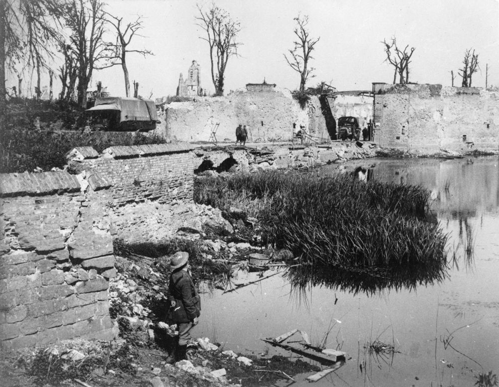 The shattered ramparts of Lille Gate and the St. Eloi Road from across the maot. Ypres, September 1917.